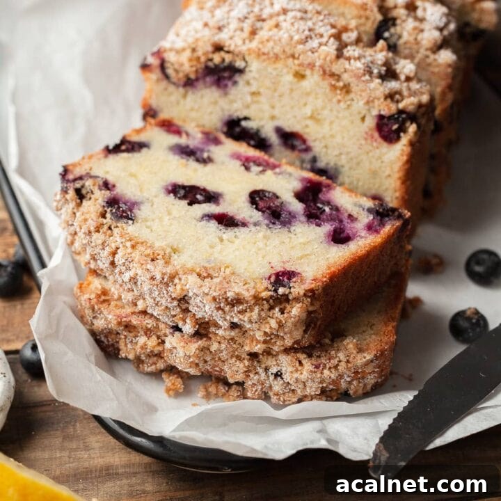 sliced gluten free blueberry bread topped with brown sugar streusel