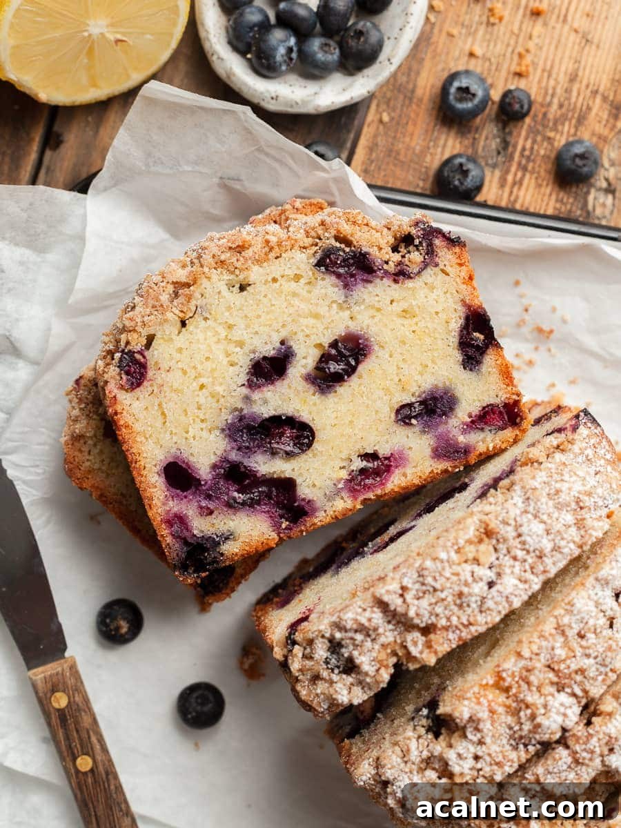 sliced gluten free blueberry bread topped with brown sugar streusel 