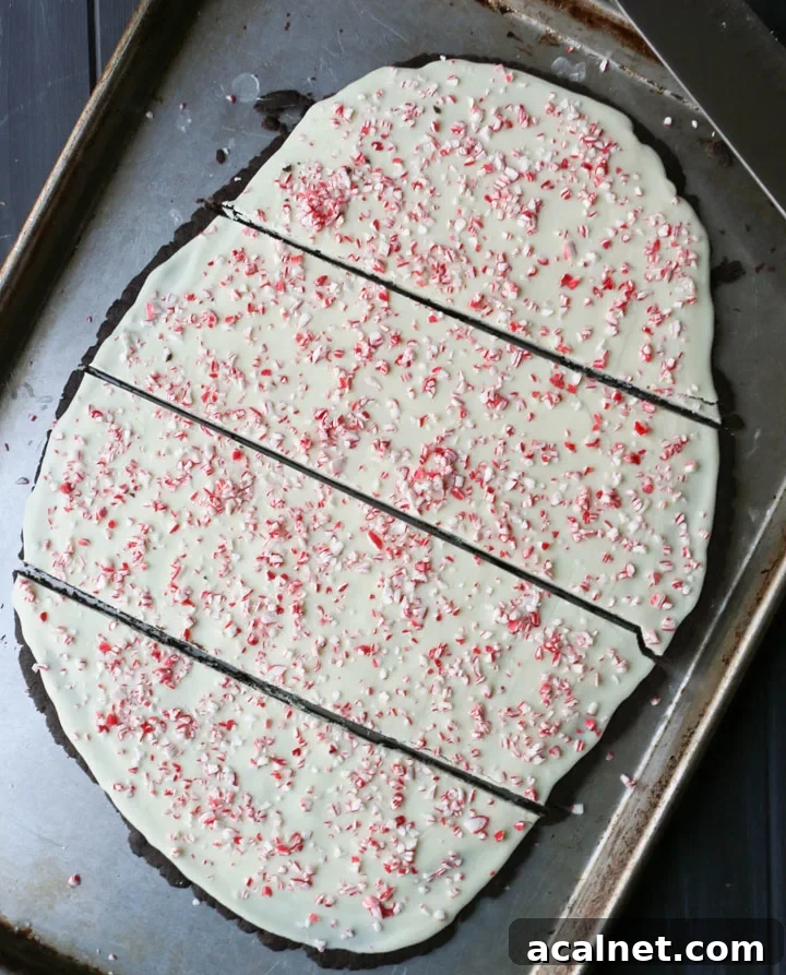 peppermint chocolate cookie bark cut into four pieces