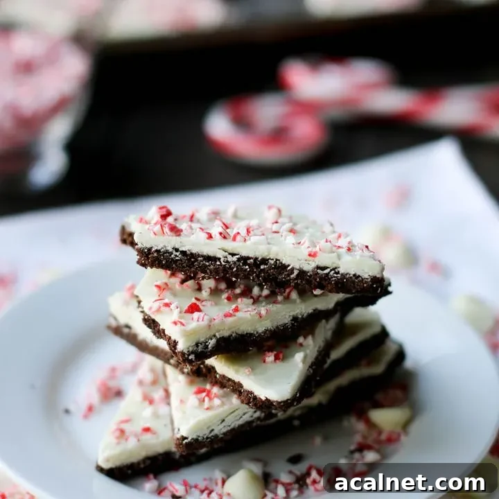 stack of peppermint chocolate cookie bark on a white plate