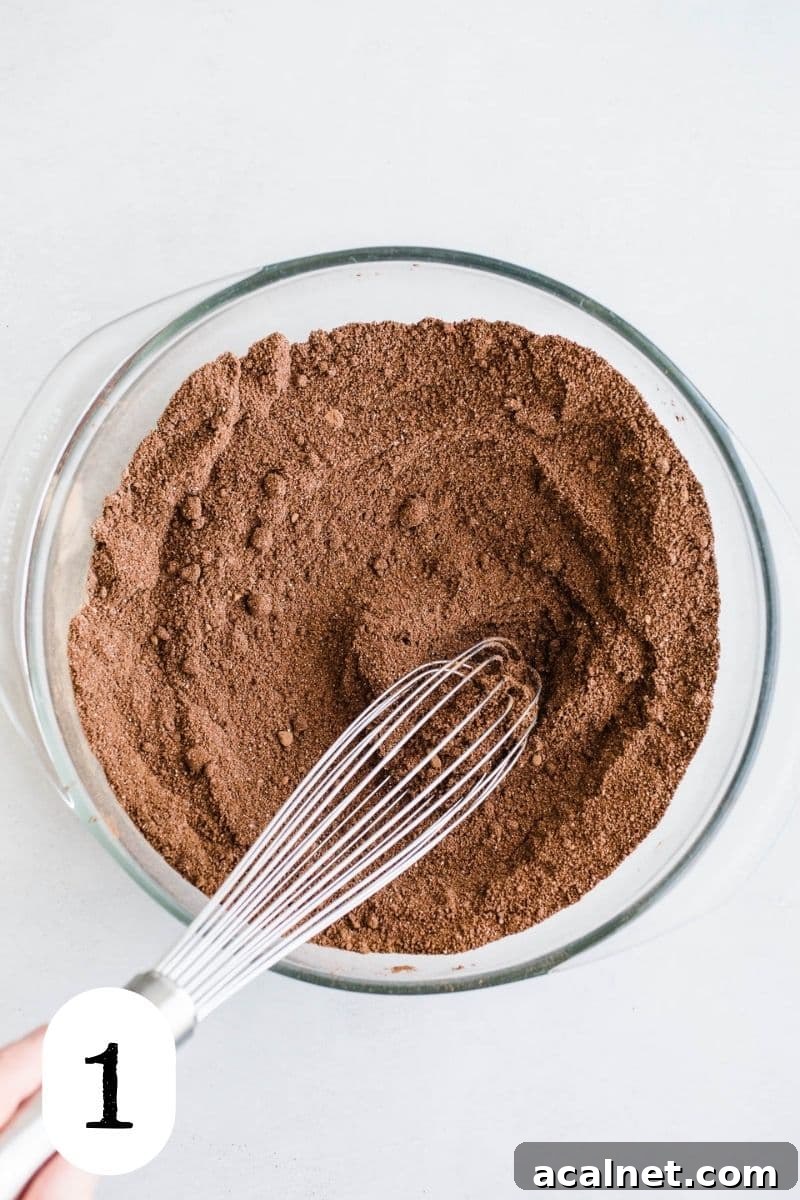 Cocoa and coconut flour in a glass mixing bowl.