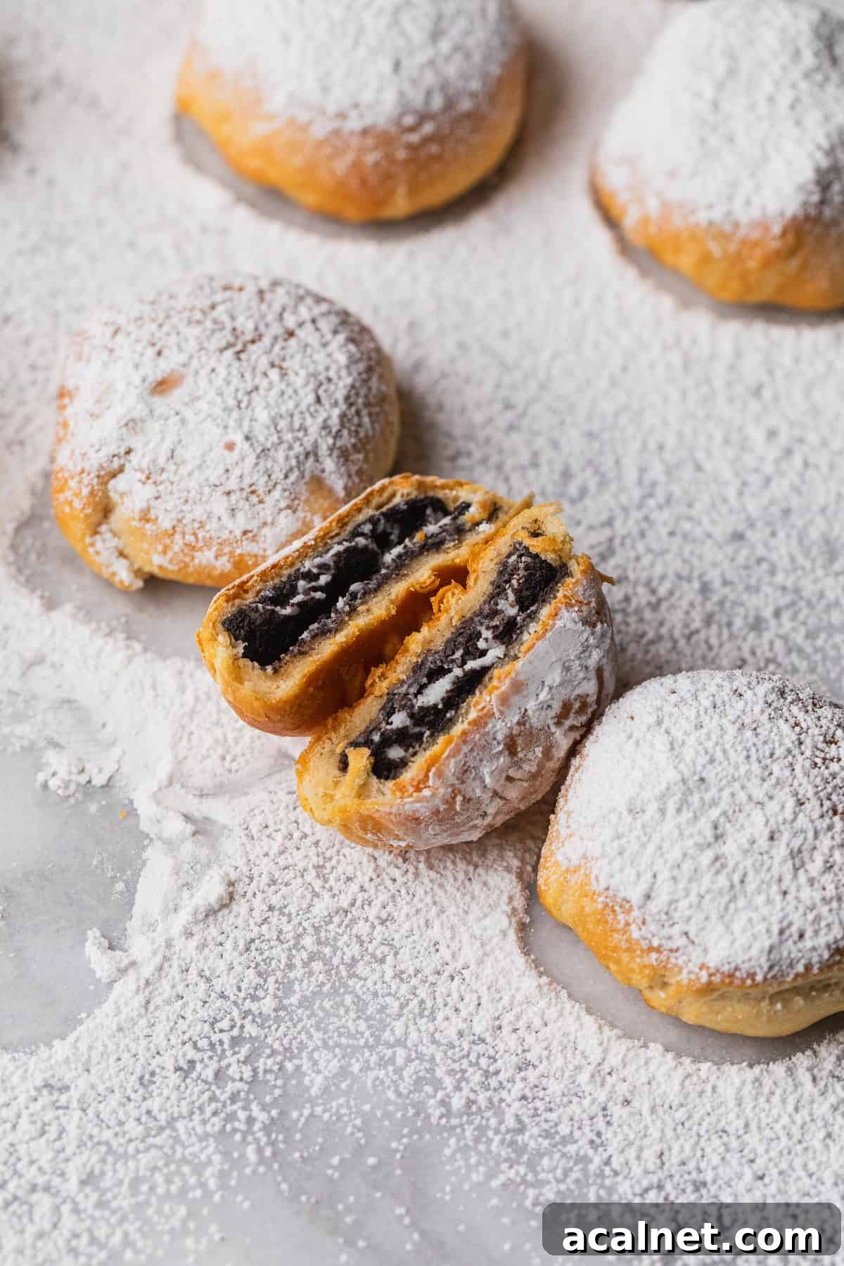Air Fryer Oreo Bites — 3-Ingredient Dessert Recipe 9 Some air fried oreo cookies on a marble cutting board.