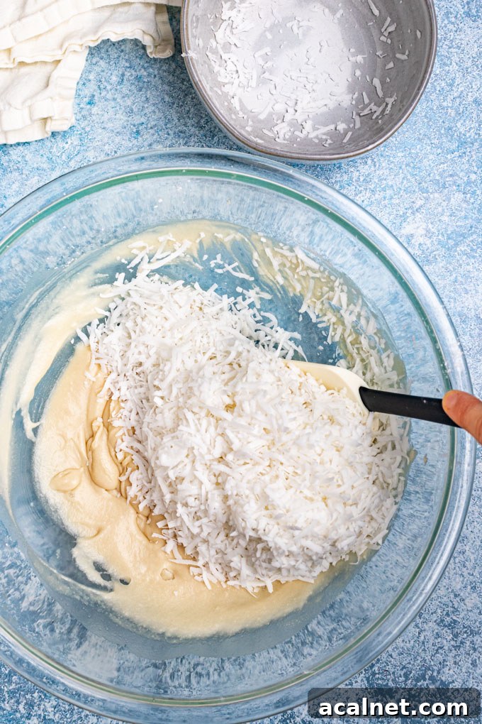 Shredded coconut added to honey and coconut cream mixture.