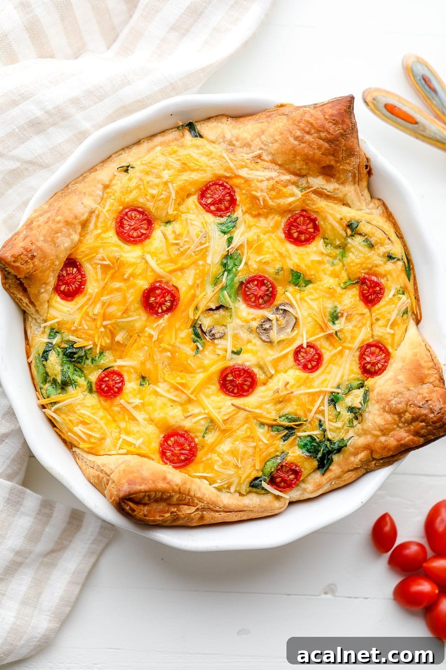 Vegan Just Egg Quiche Recipe: Flaky Crust & Creamy Filling 2 A baked JUST Egg quiche in a white pie plate.