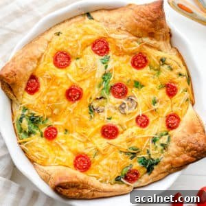 Vegan Just Egg Quiche Recipe: Flaky Crust & Creamy Filling 6 A baked JUST Egg quiche in a white pie plate.