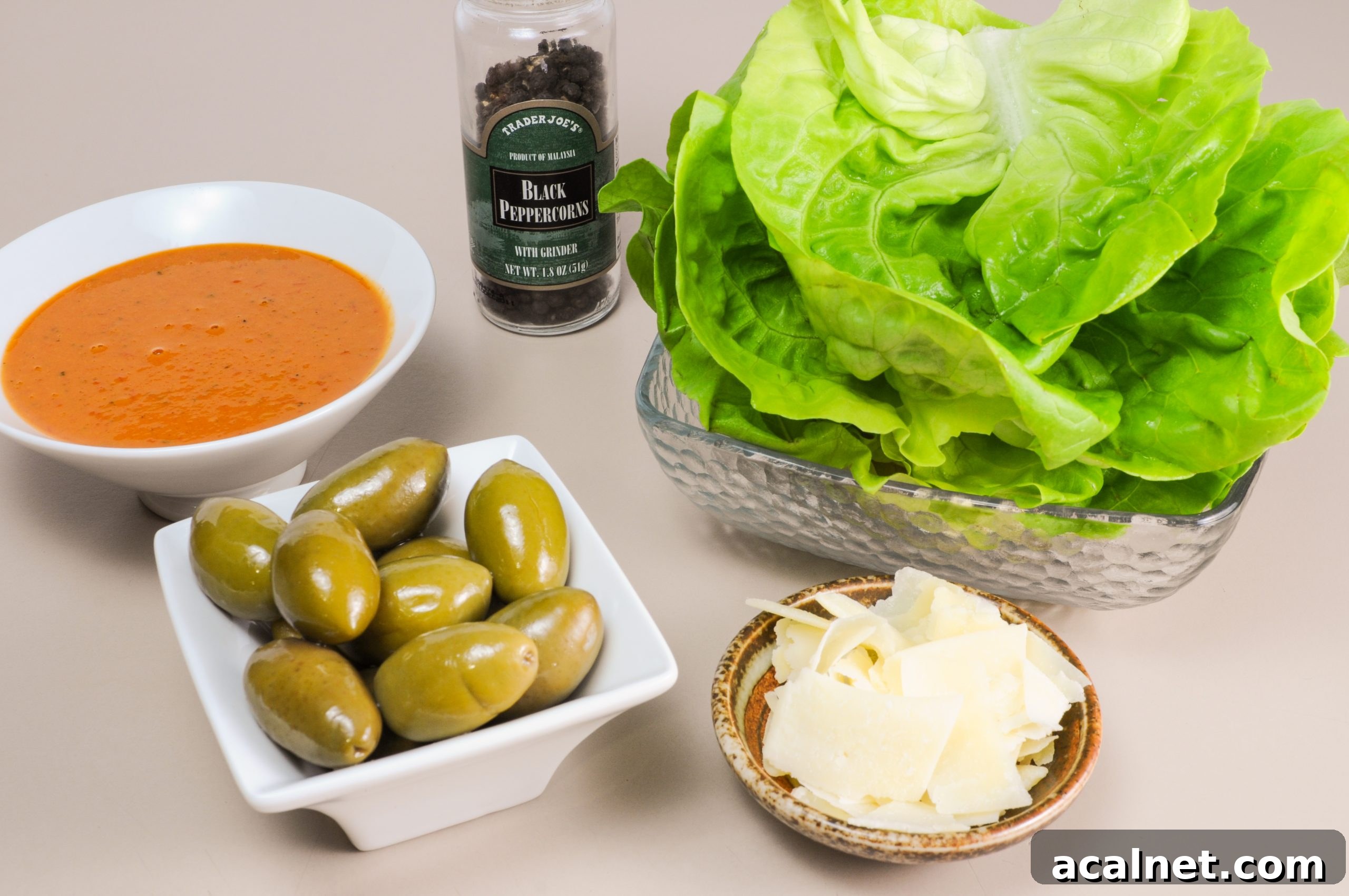 Butter Leaf Salad with Cerignola Olives, Shaved Parmesan, and Roasted Tomato Vinaigrette