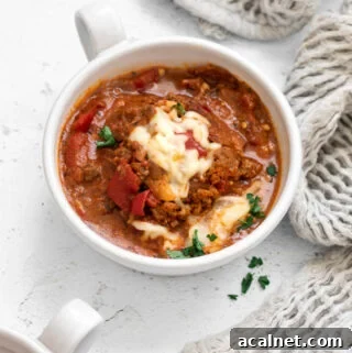 Pizza soup with pepperoni in a soup bowl