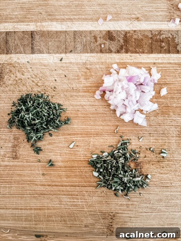 Three piles of minced herbs and onion