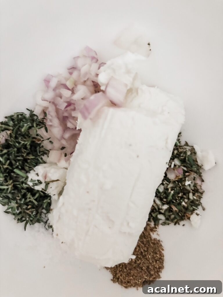 The goat cheese and herbs in a bowl