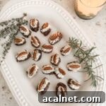 The platter of finished Stuffed Dates with Cheese and Herbs