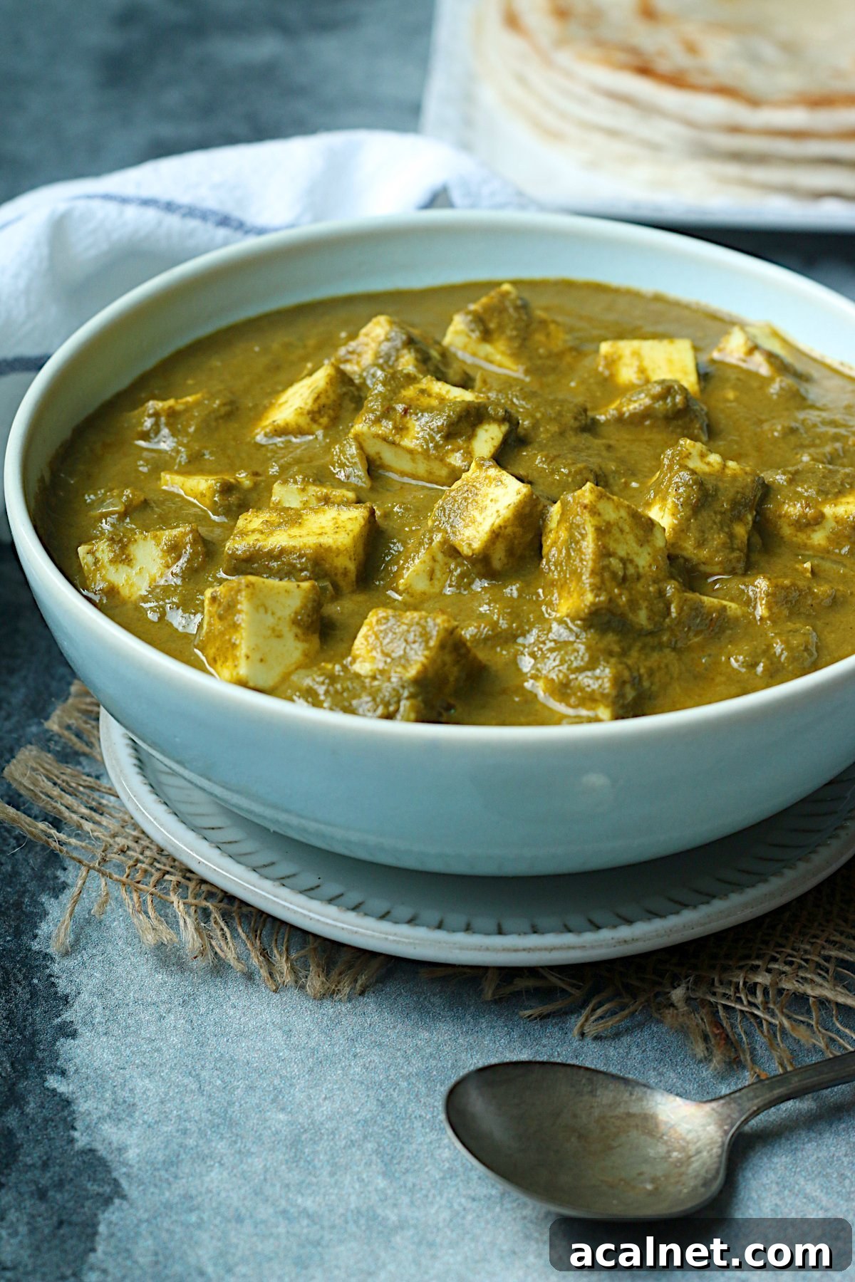 Homemade Palak Paneer in a pale blue bowl.