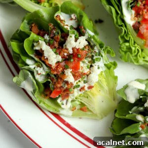 A wedge of romaine lettuce with blue cheese dressing, bacon bits, tomatoes, it has the best flavor and is handheld!