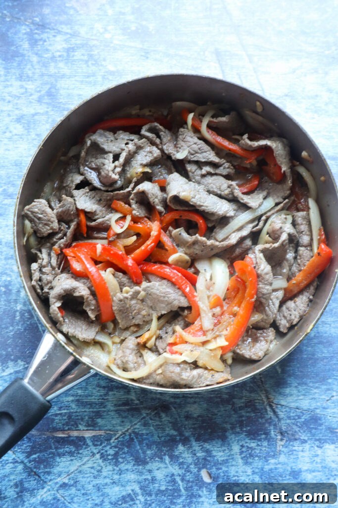 Cooking garlic pepper beef in a skillet