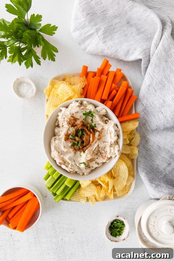 French Onion Dip served with carrots, celery, and chips.