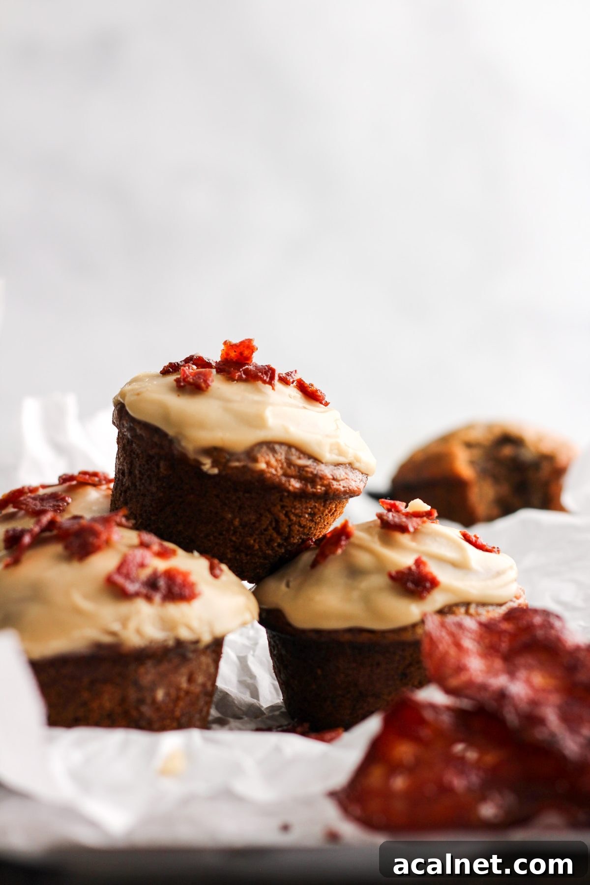 stack of banana muffins with maple glaze and bacon for food blog and food photography