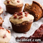 A maple nut banana muffin with maple frosting and bacon bits.