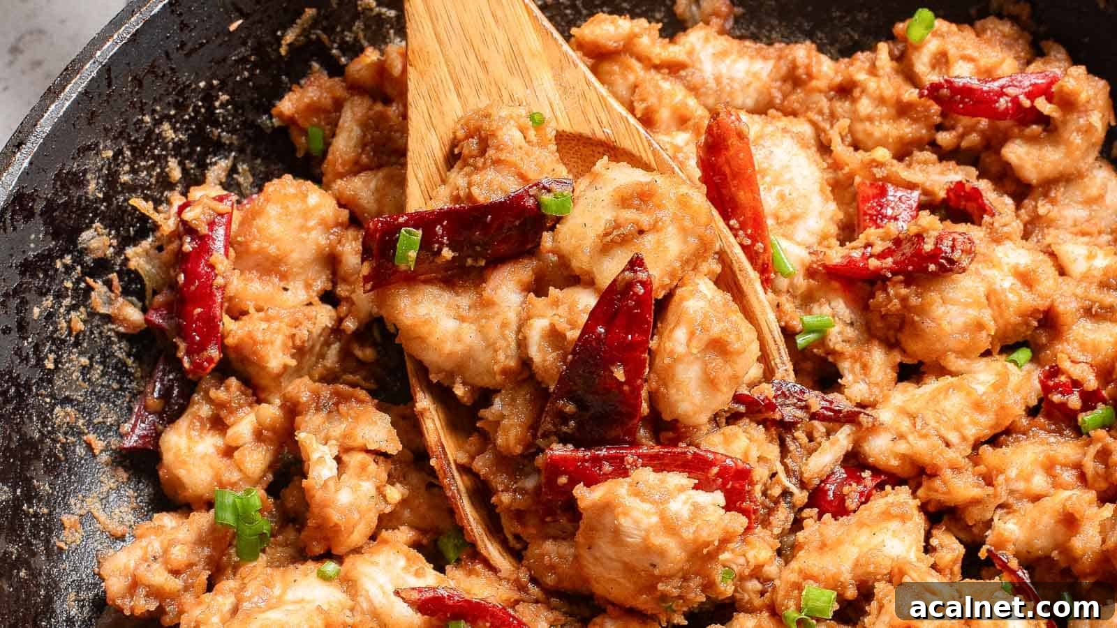 29 Chicken Dinners That Keep Coming Back to Our Weekly Menu 18 Stir-fried diced chicken with dried chilies and spring onions in a black skillet.