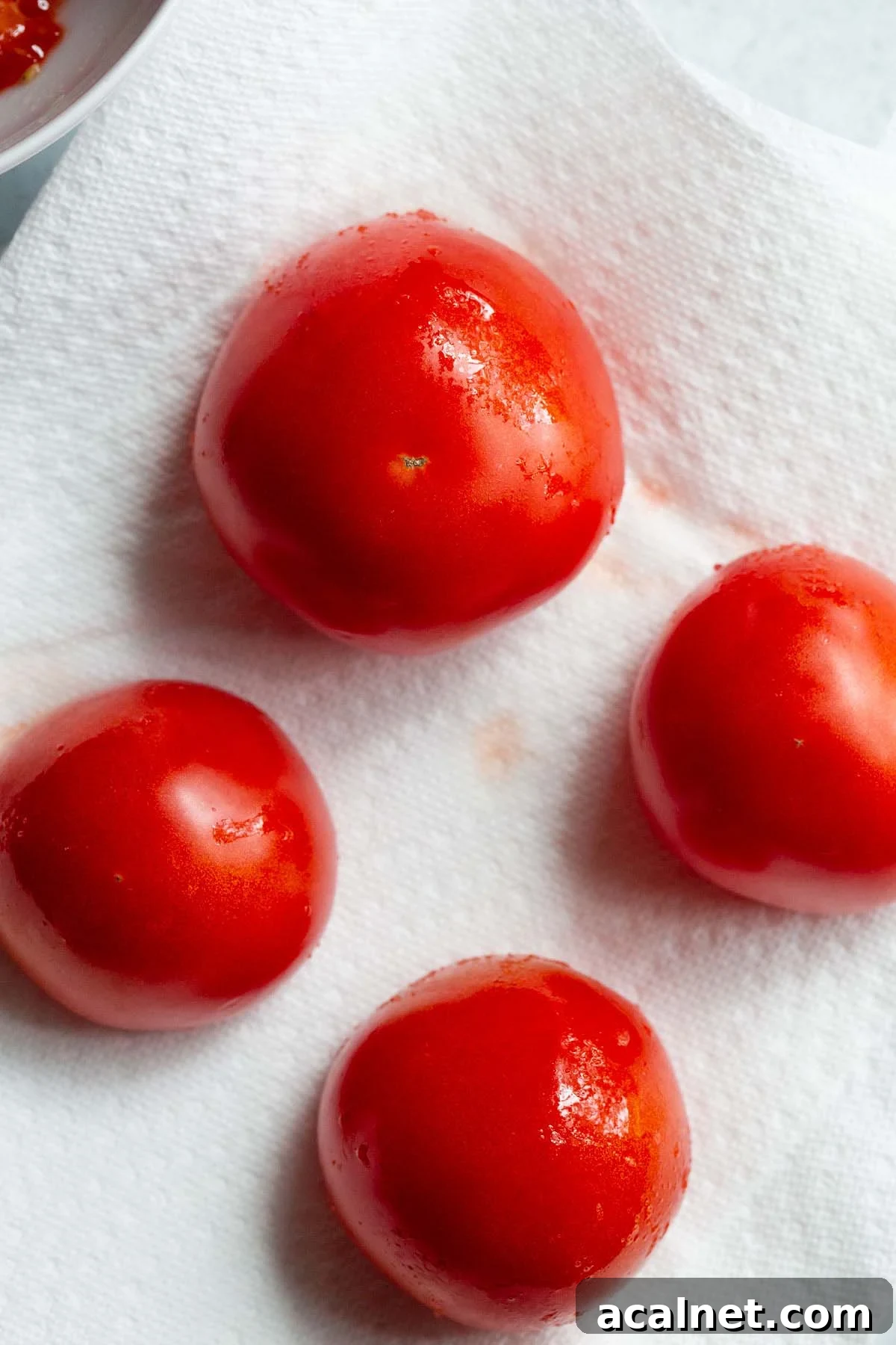 Drying tomatoes on paper towels.