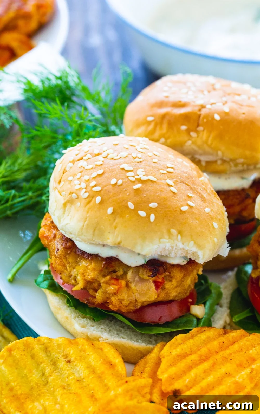 Burgers made with crawfish on a plate.