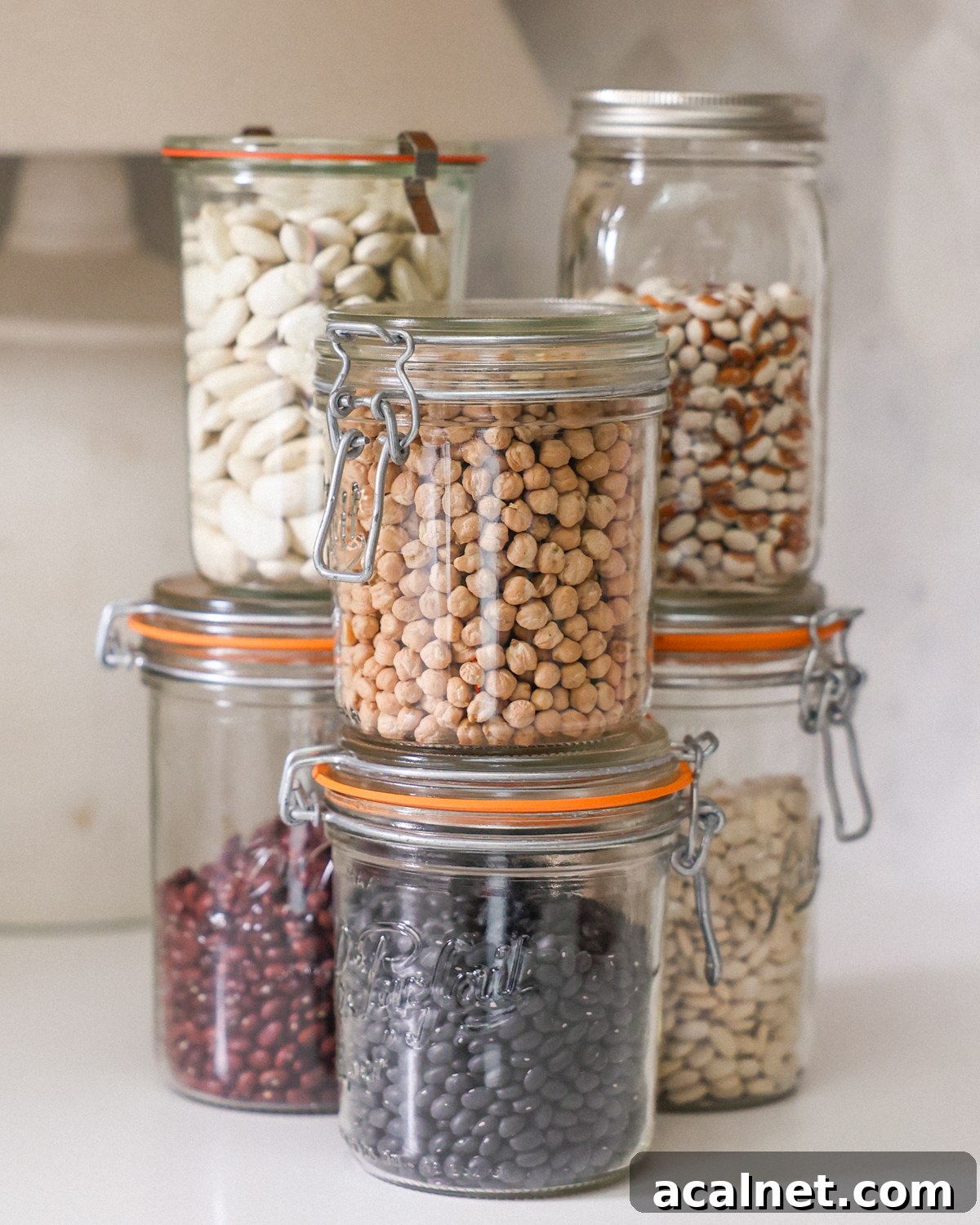 Beans in jars on the kitchen counter.