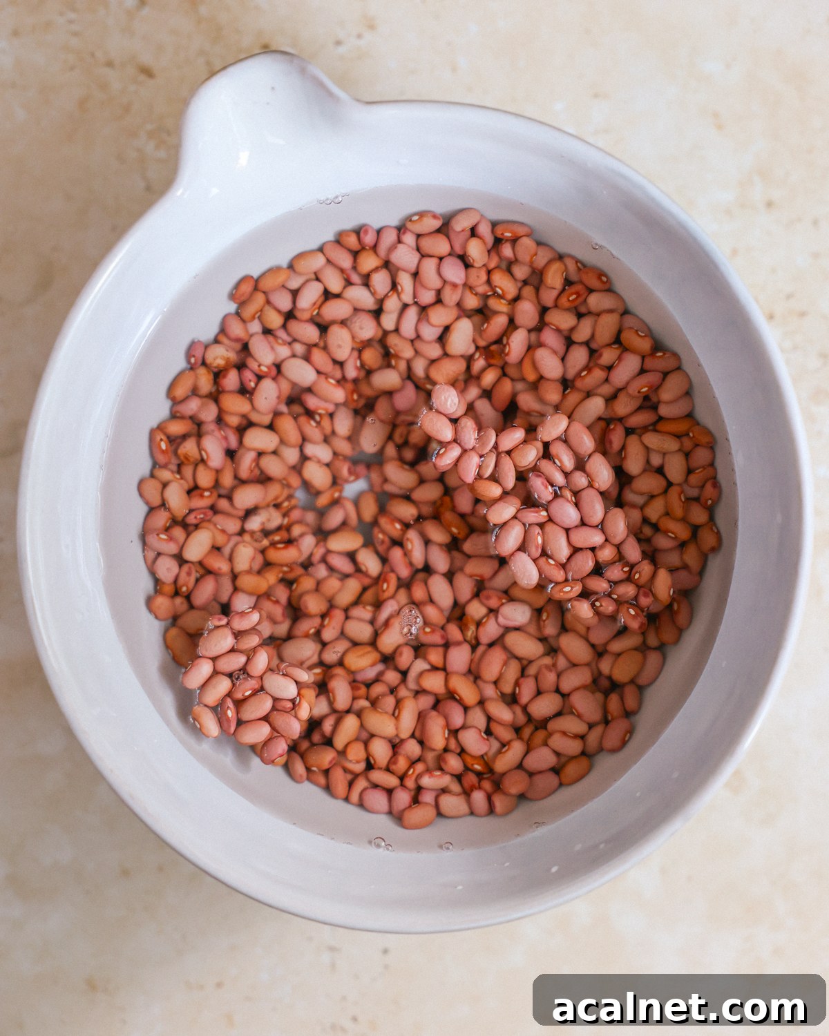 Soaking beans in a large bowl. 