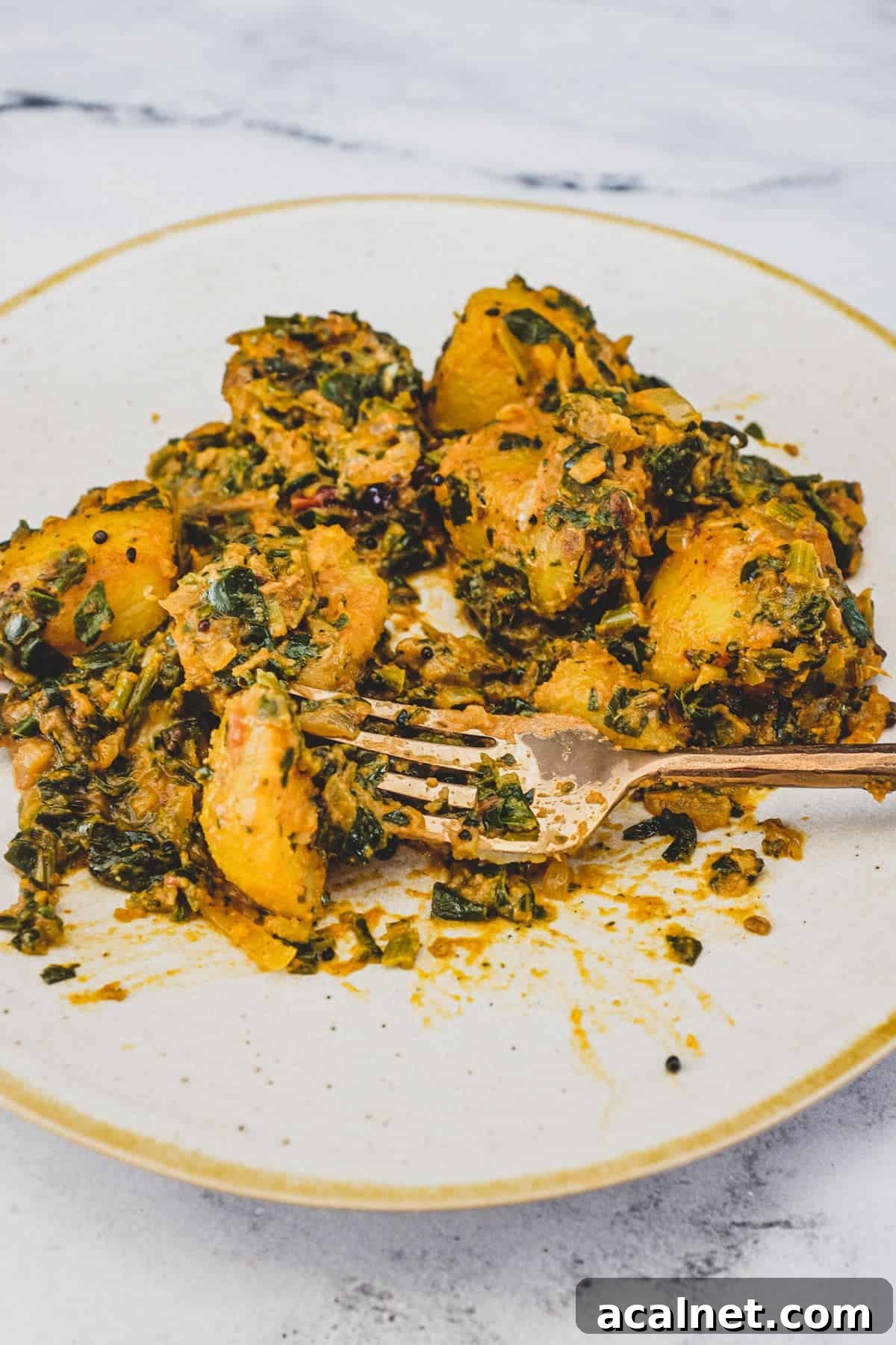 Spinach and Potato cooked in Indian Spices.