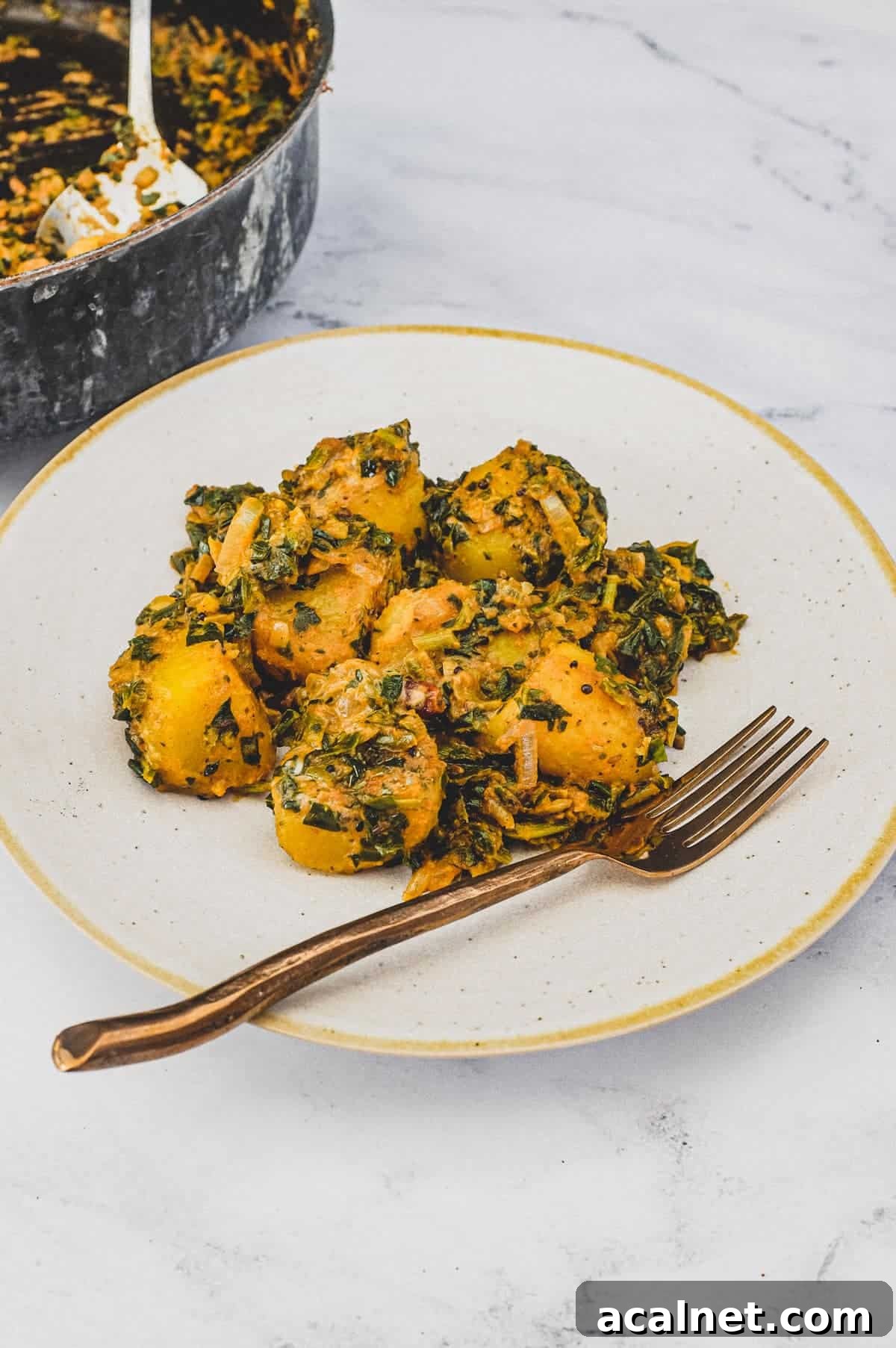 Spinach and Potato cooked in Indian Spices.