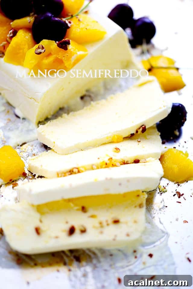 Semifreddo topped with fresh cherries, chopped mangoes, and toasted pecans.