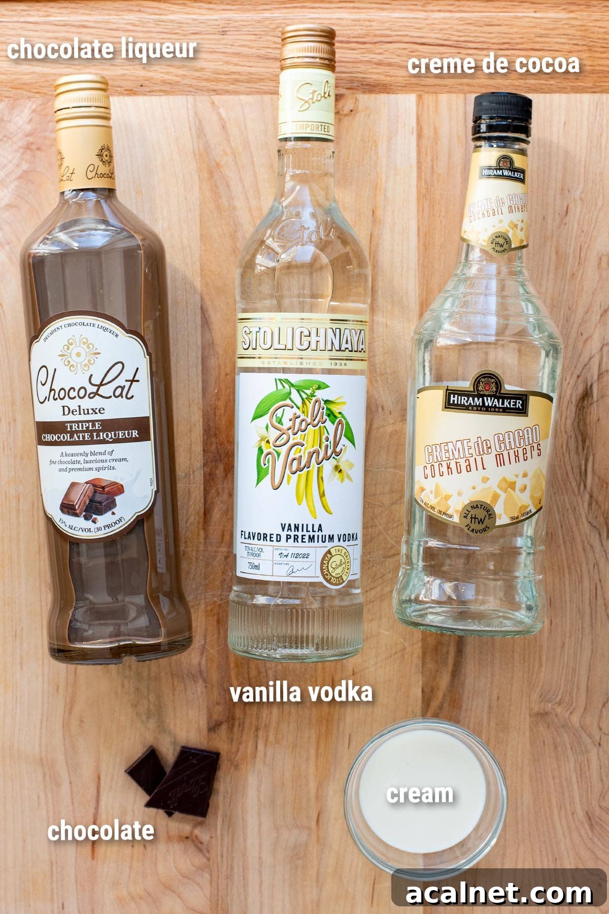 Chocolate martini ingredients laid out on a wooden cutting board.