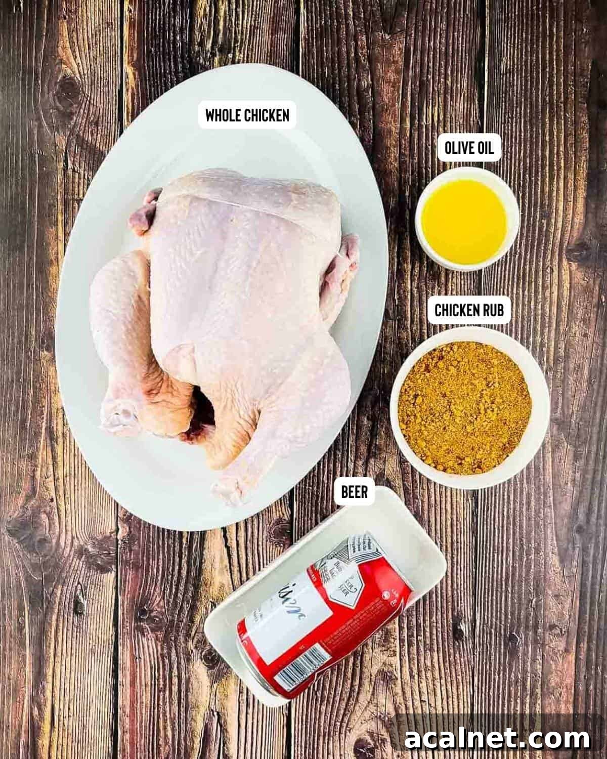 Ingredients for pellet grill beer can chicken placed on a wooden table.