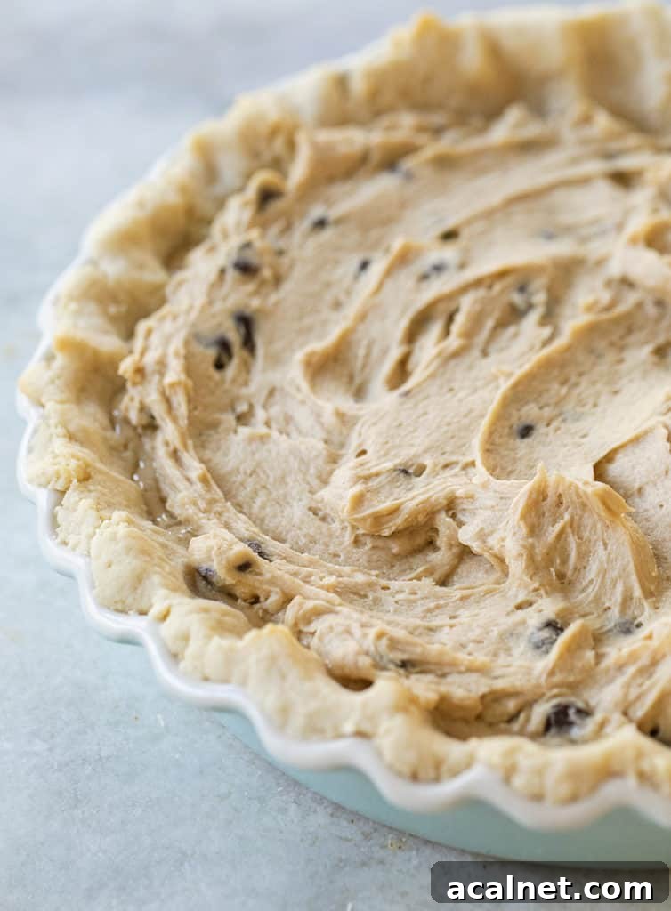 Chocolate Chip Cookie Pie with shortbread cookie pie crust before it's baked.