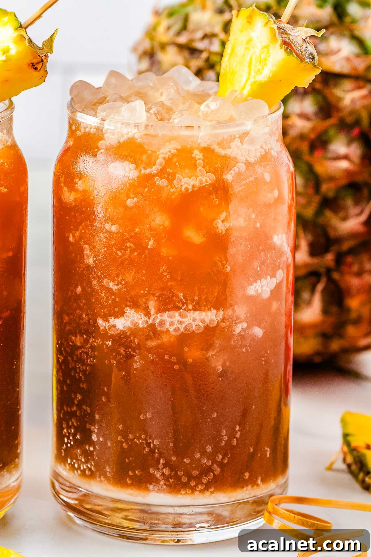 A Swig Waikiki drink garnished with a pineapple slice.