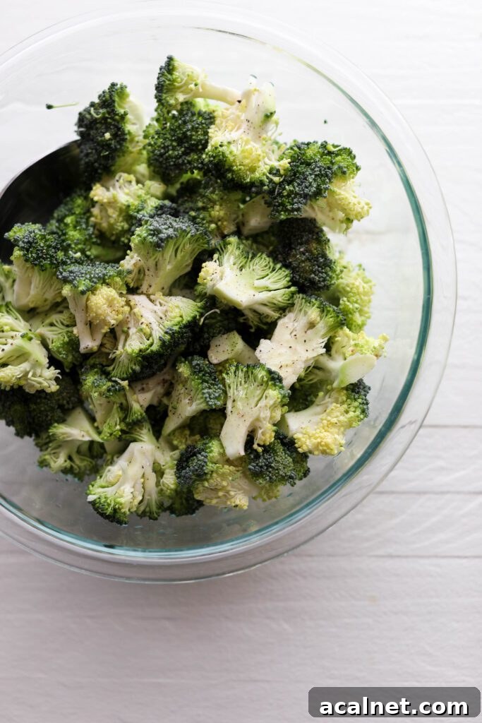 broccoli florets in a glass bowl by Flora & Vino