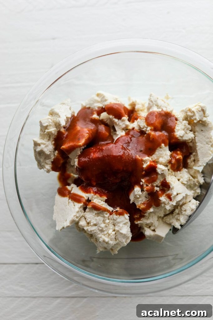 Tofu with BBQ sauce and sriracha in a bowl by Flora & Vino