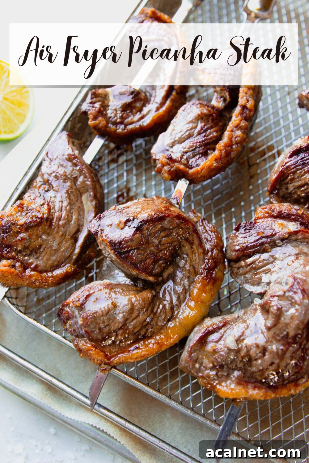 Air Fryer Picanha Steak Recipe: Perfect Crispy Crust & Juicy Center 15 Cooked picanha steak on skewers with limes and parsley.