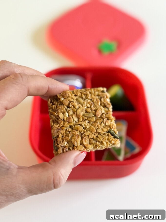 Nut-Free Oat Flapjacks Recipe — Gluten-Friendly Snack 2 Crunchy and chewy flapjacks, completely nut free and brilliant to batch make for packed lunches and school snacks served in a bright red snack box.