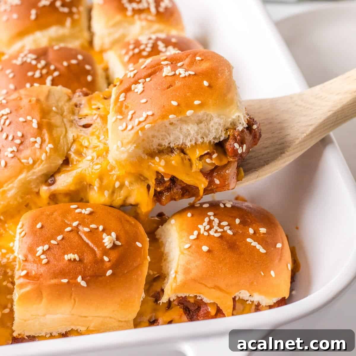 Serving sloppy joe sliders out of a pan.