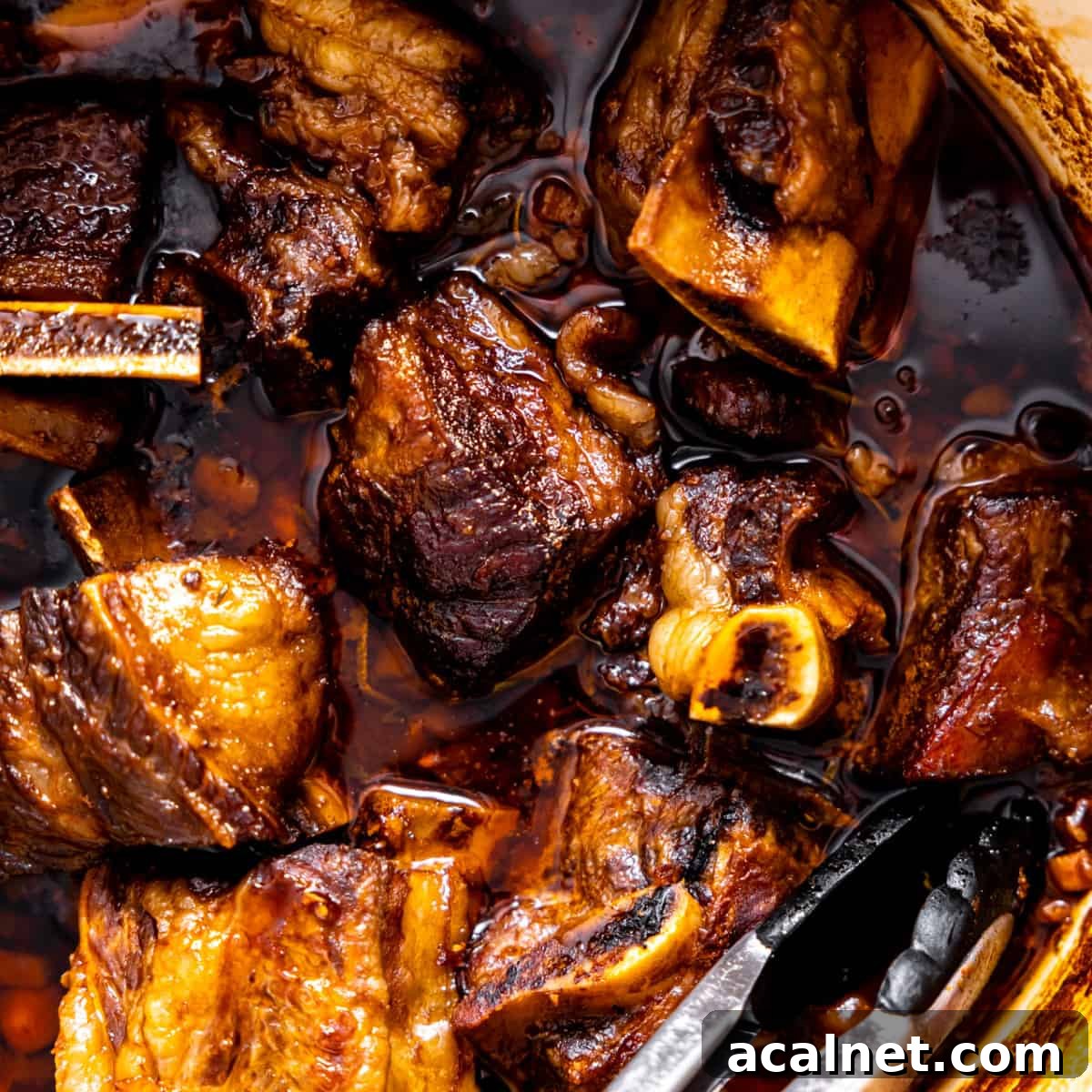 Beef short ribs in a braising pan.