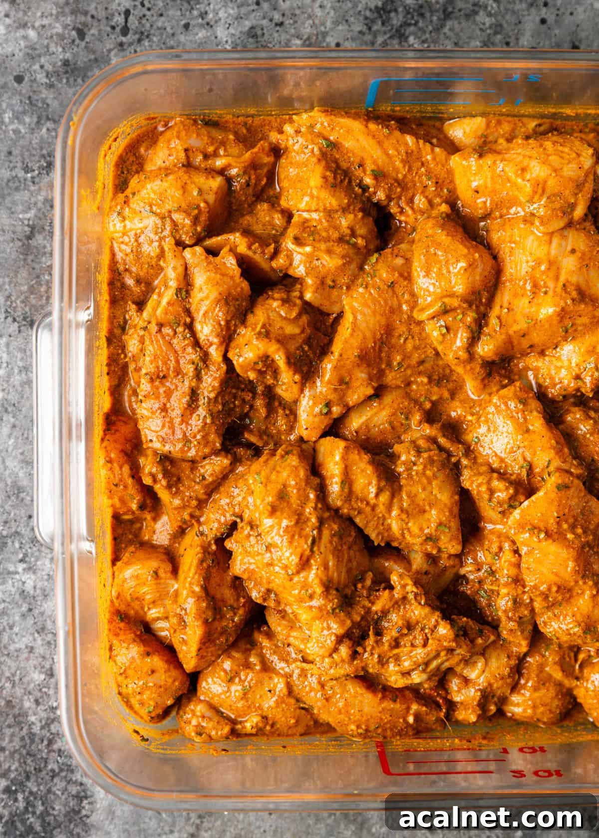 closeup overhead: coated chicken in measuring bowl