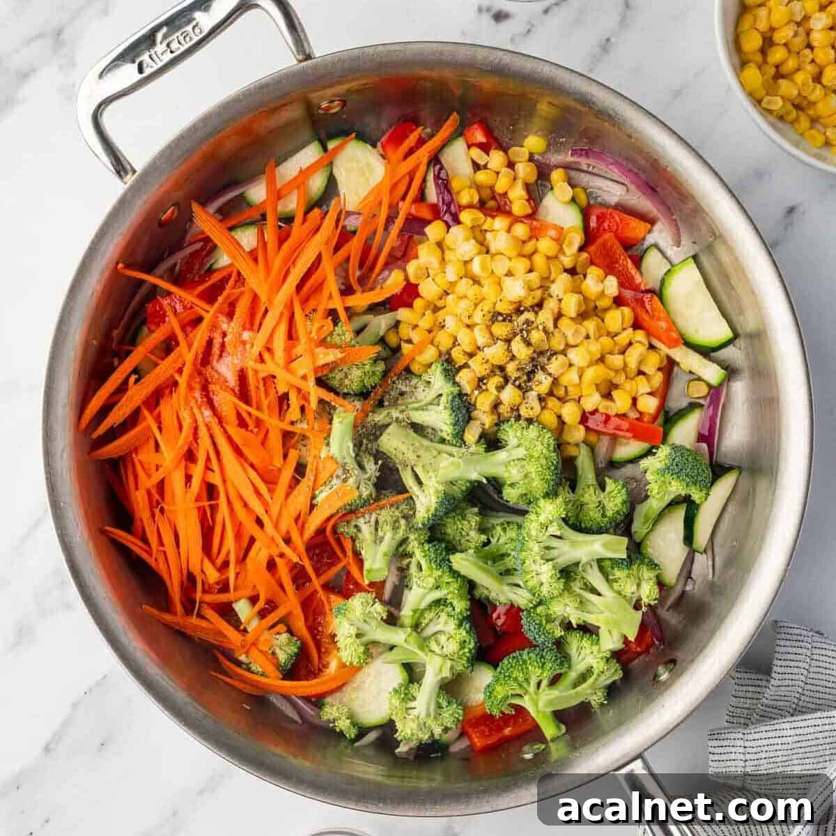 Veggies are cooked in a skillet.