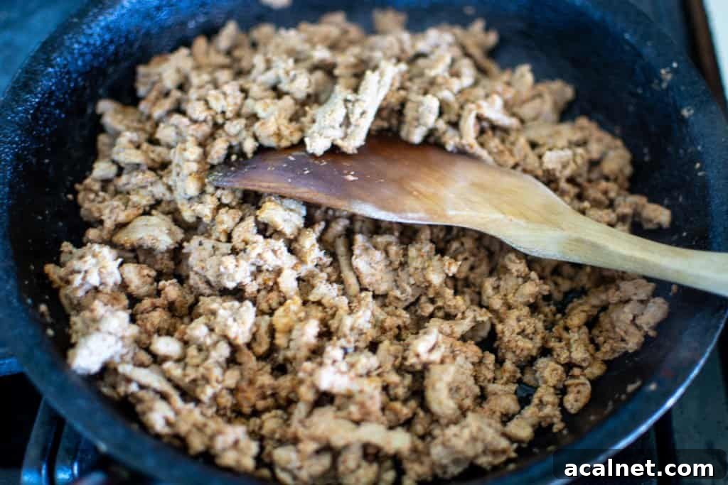 A black frying pan with browned g