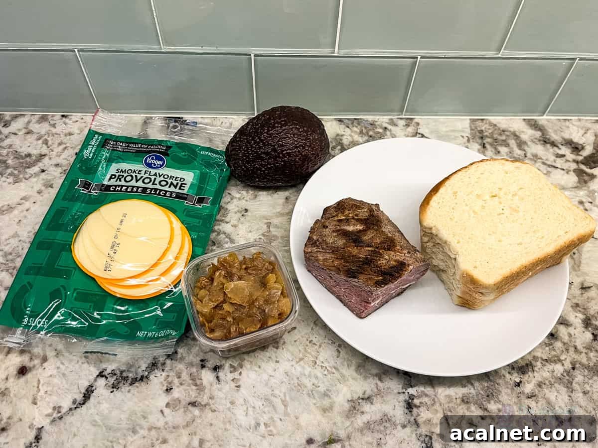 Ultimate Tri-Tip Sandwich Recipe: Juicy Steak Sandwich Guide 3 Ingredients on kitchen counter: cheese, caramelized onions, steak, bread, and avocado.