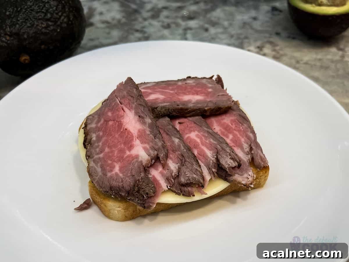 Ultimate Tri-Tip Sandwich Recipe: Juicy Steak Sandwich Guide 5 Slice of toasted bread with cheese and meat on top.