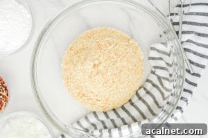 Amaretto Booze Balls: Almond Liqueur Truffles Recipe 5 Glass bowl filled with finely crushed vanilla wafers.