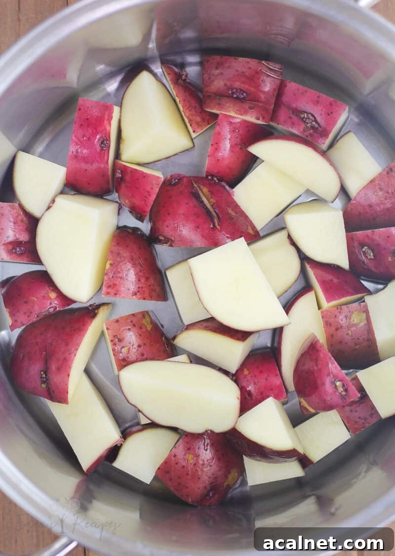 chopped red potatoes in metal pot