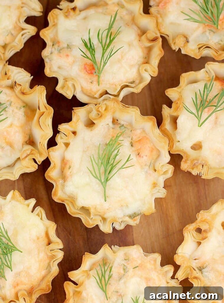 top down view of a mini smoked salmon tart with dill garnish
