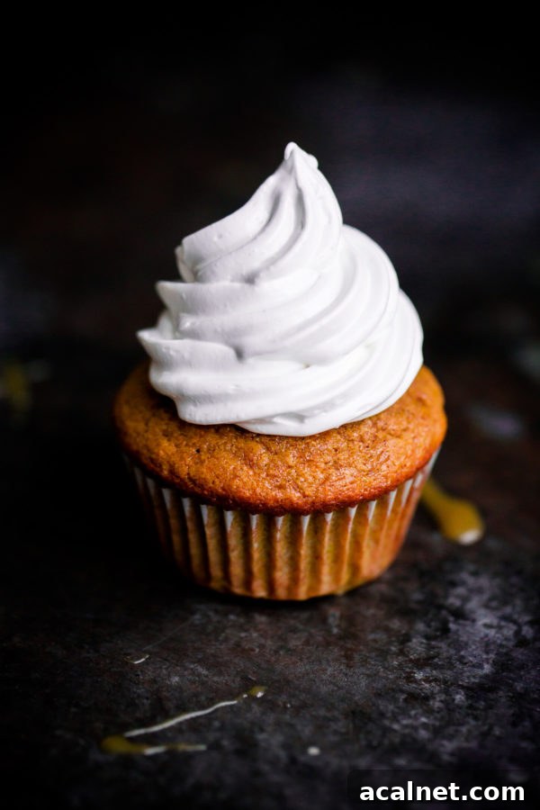 EASY Pumpkin Cupcakes topped with marshmallow frosting!