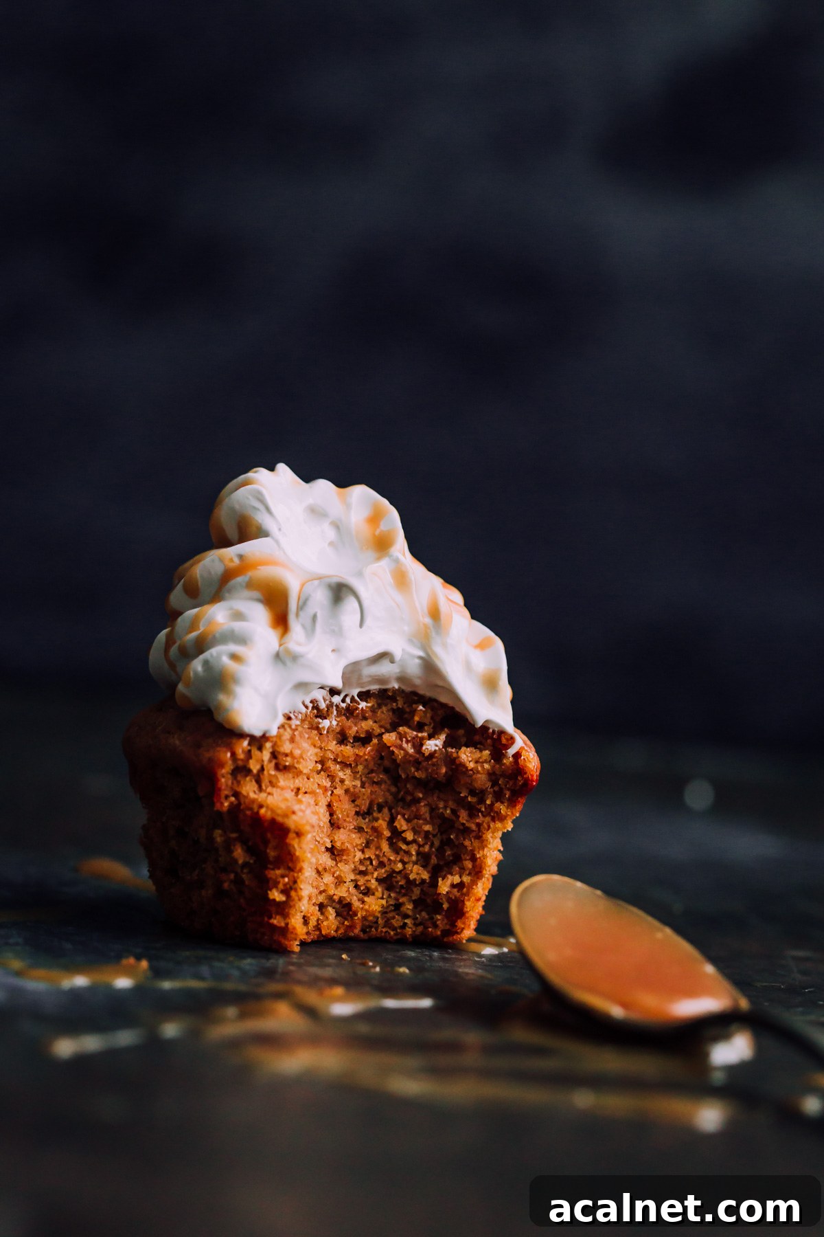 Pumpkin Cupcakes with Marshmallow Frosting and Caramel. This decadent fall cupcakes are lightly spiced and make a wonderful portable fall dessert.