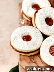 cookie sandwiched with dulce de leche on cutting board