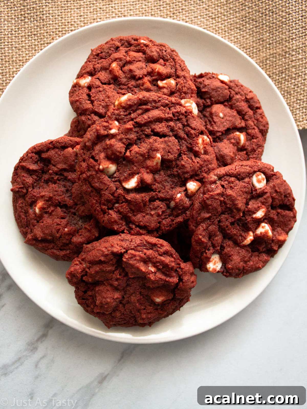Red velvet chocolate chip cookies on a white plate.
